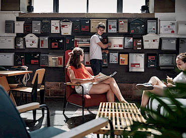 Community area in the entrance hall with mailboxes at Grünhof Freiburg