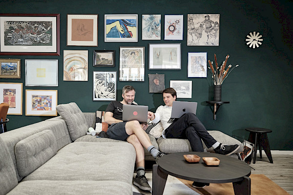 Coworkers discuss in a stylish setting
