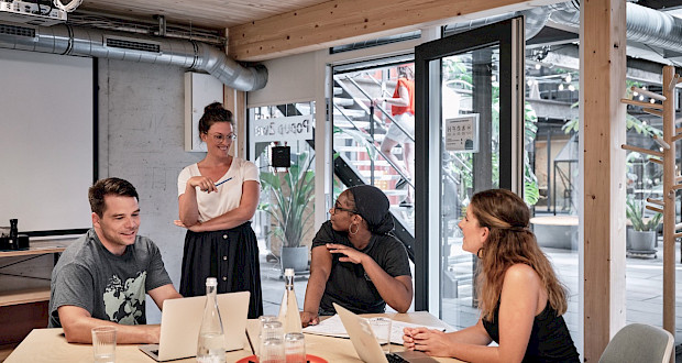 People exchange ideas in a meeting room