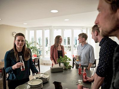 Coworkers chatting in the community kitchen