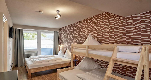 Chic family room with 4 beds at Hokk Hotel